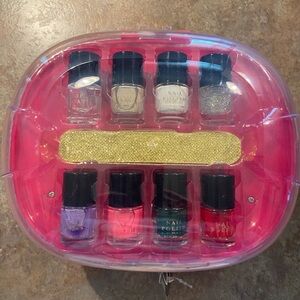 NWT 10 pc nail dryer set. 7 polishes, 1 top coat, 1 nail file & 1 nail dryer.